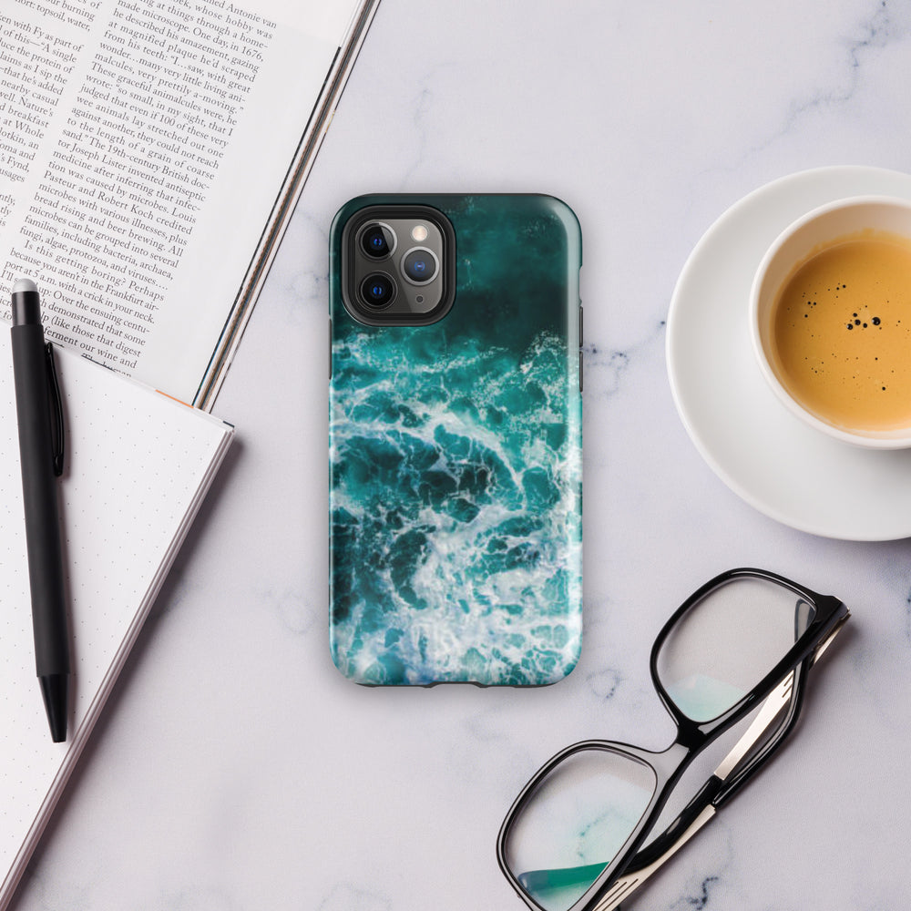 
                  
                    a phone case sitting on top of a table next to a cup of coffee
                  
                