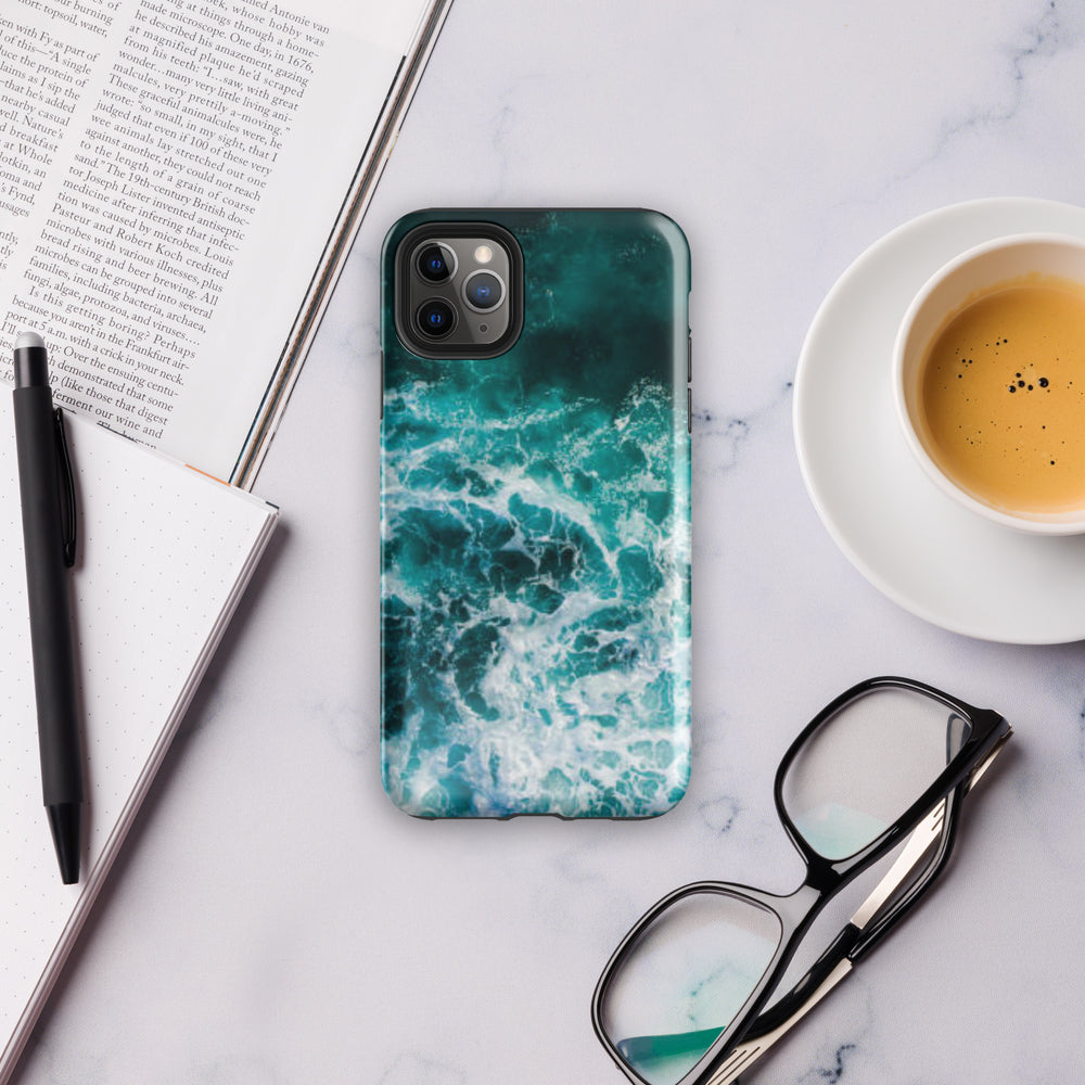 
                  
                    a phone case sitting on top of a table next to a cup of coffee
                  
                