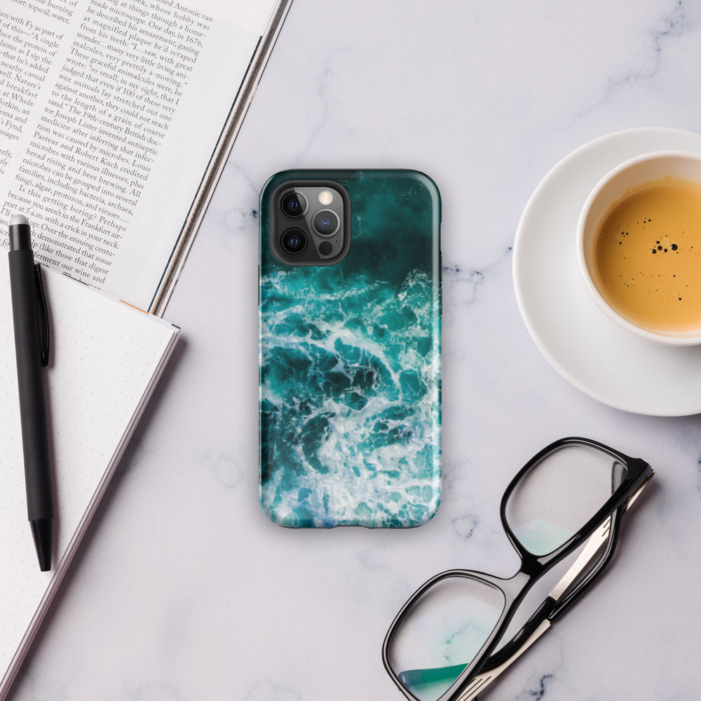 
                  
                    a phone case sitting on top of a table next to a cup of coffee
                  
                