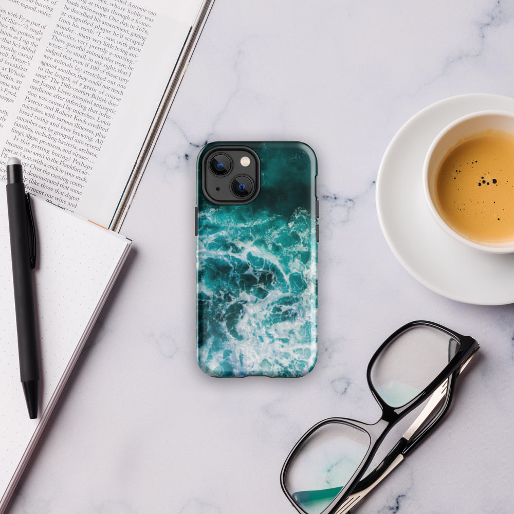 
                  
                    a phone case sitting on top of a table next to a cup of coffee
                  
                