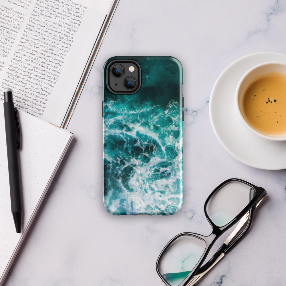 
                  
                    a phone case sitting on top of a table next to a cup of coffee
                  
                