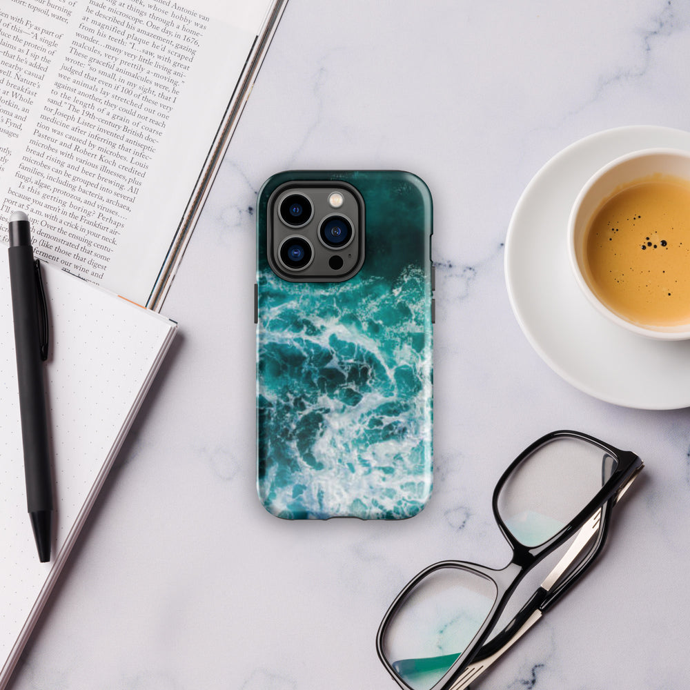 
                  
                    a phone case sitting on top of a table next to a cup of coffee
                  
                