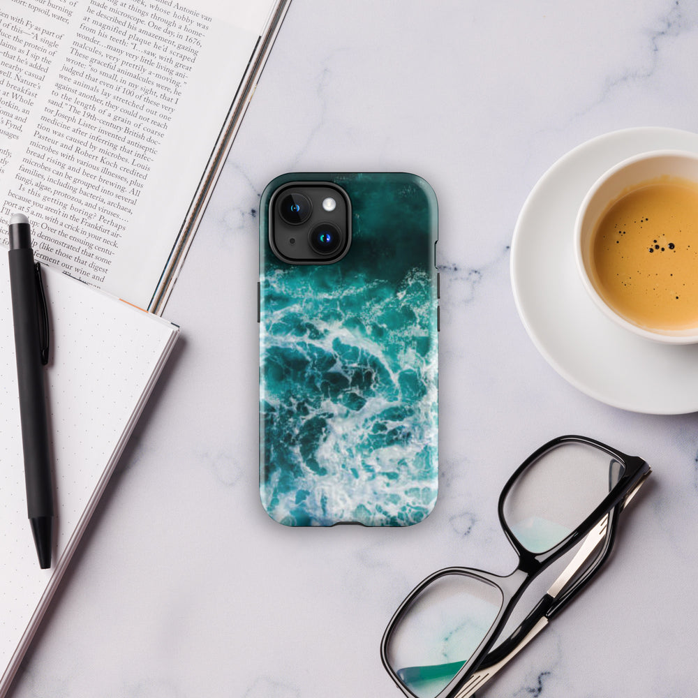 
                  
                    a phone case sitting on top of a table next to a cup of coffee
                  
                